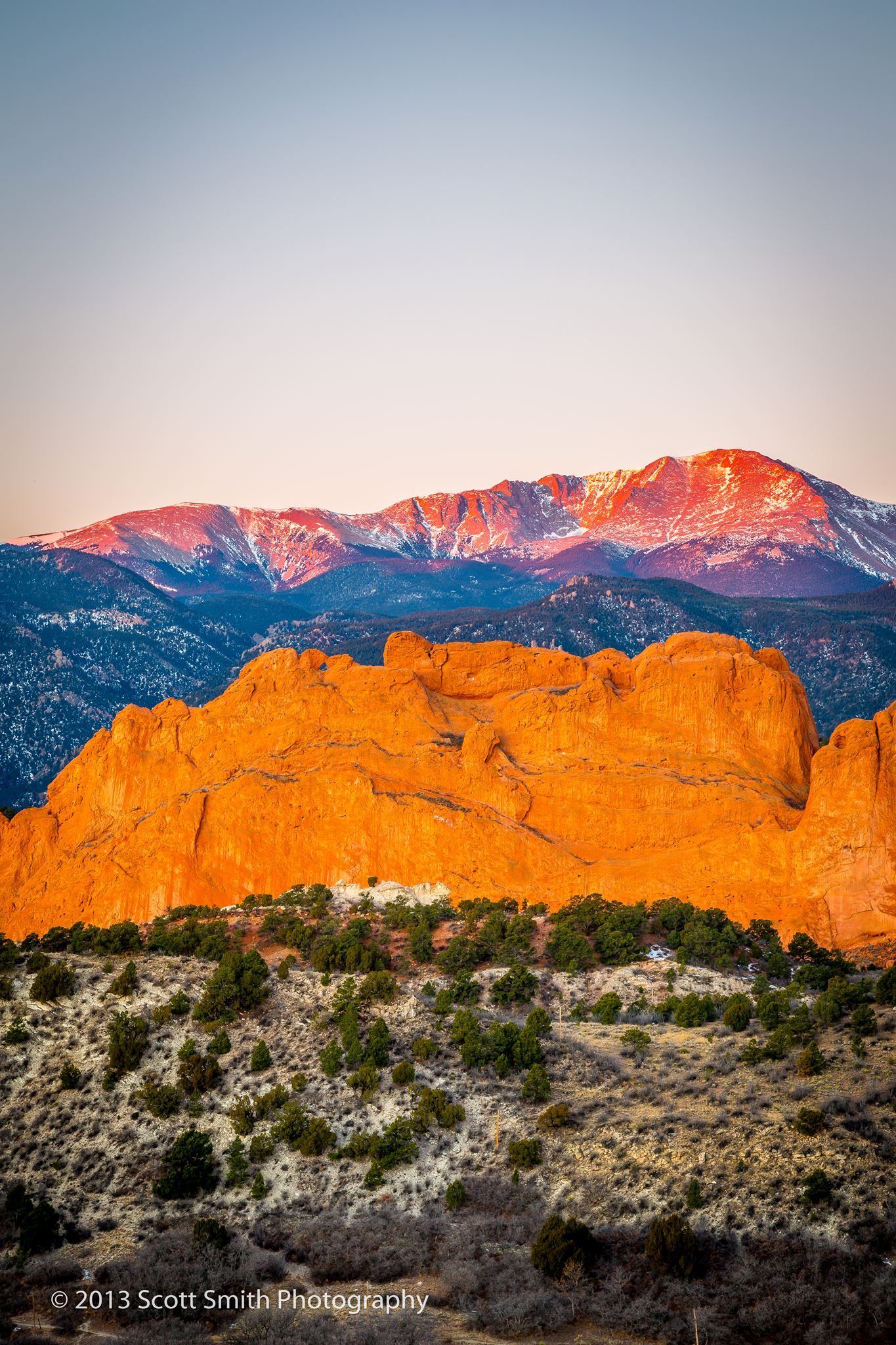 Morning Peaks - Pike's Peak, behind the Garden of the Gods, lit by the rising sun. by Scott Smith Photos
