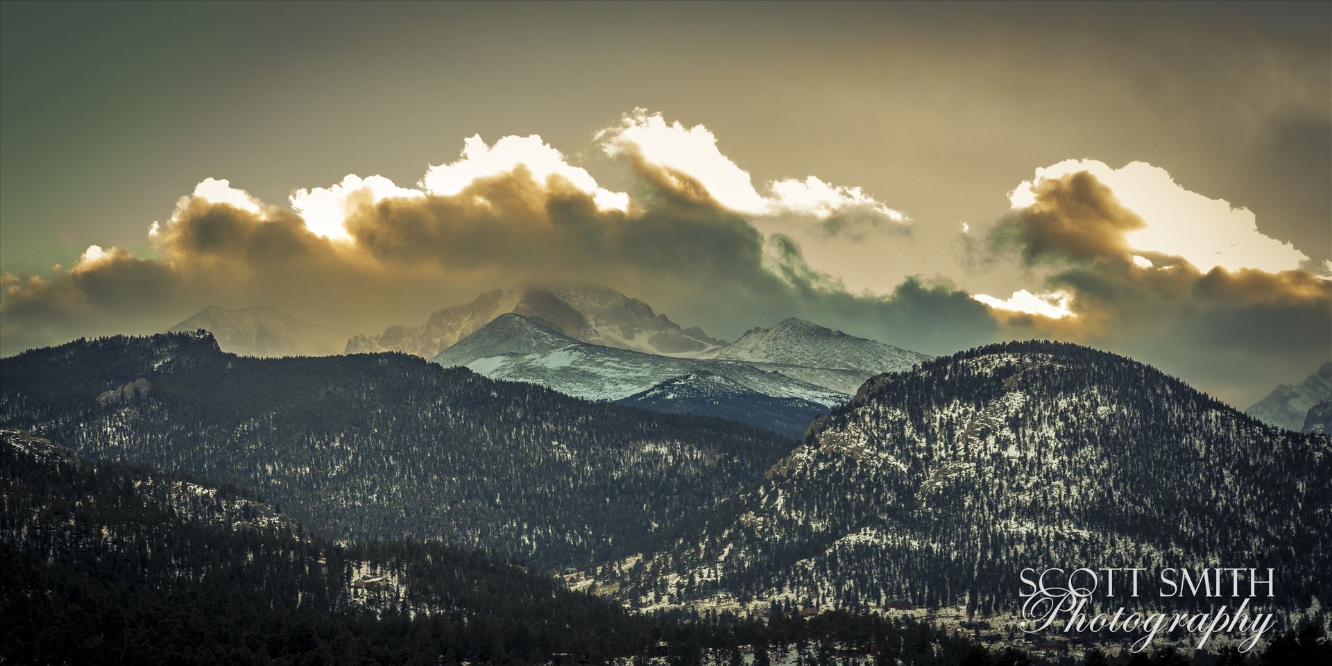 Sunset from Estes - The sun sets over peaks in the Rocky Mountain National Park, as seen from near the famous Stanley Hotel in Estes Park. by Scott Smith Photos