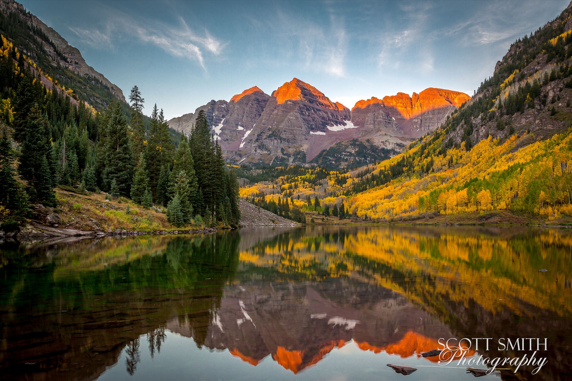 The sun rising on the Maroon Bells - A chilly September morning.  The sun lights the peaks of the Maroon Bells. by Scott Smith Photos