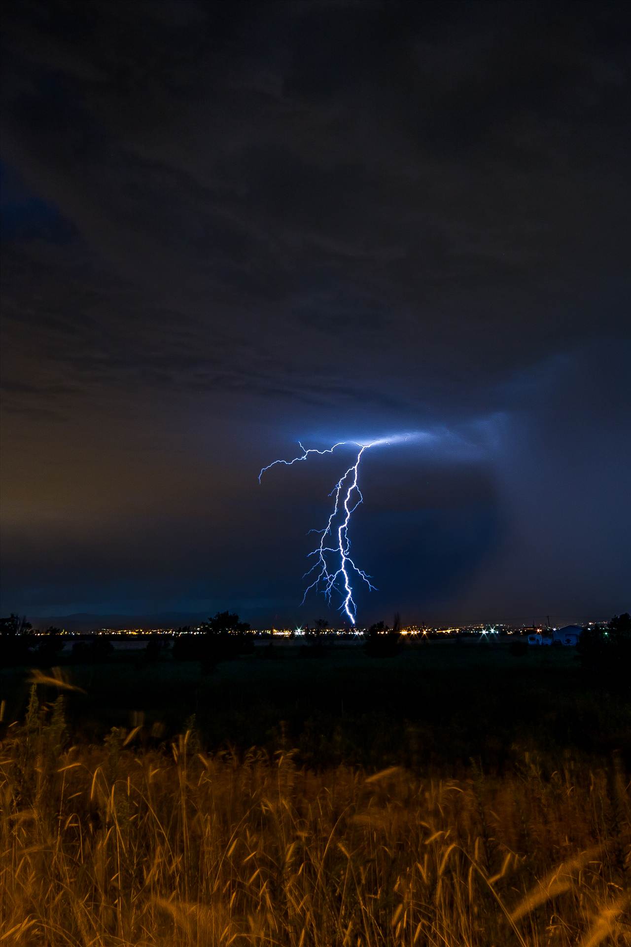 Lightning Flashes 7 - A series of shots from the end of the street, during a powerful lightning storm near Reunion, Colorado. by Scott Smith Photos