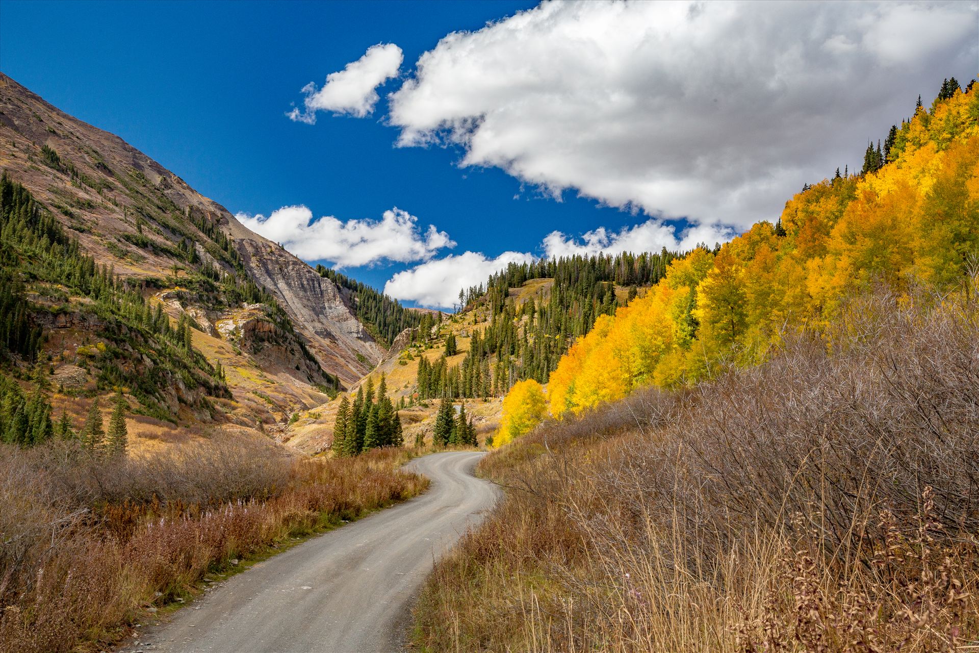Schofield Pass - Fall colors and bluebird skies Just before Emerald Lake on Schofield Pass, near Crested Butte, Colorado. by Scott Smith Photos