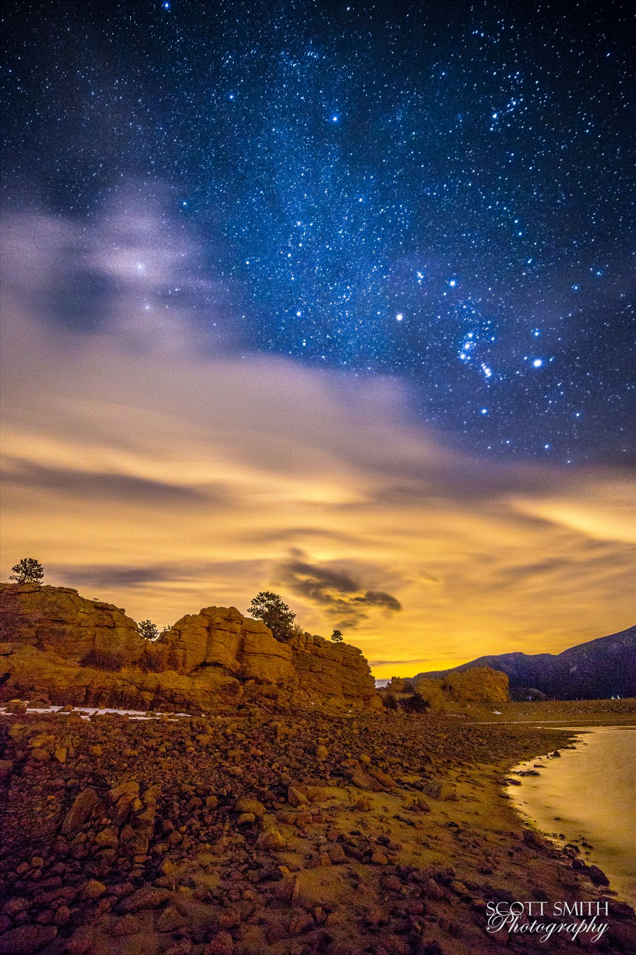 Mary's Lake At Night 2 - The milky way just manages to peek through the clouds, over Mary's Lake near Estes Park, Colorado. by Scott Smith Photos