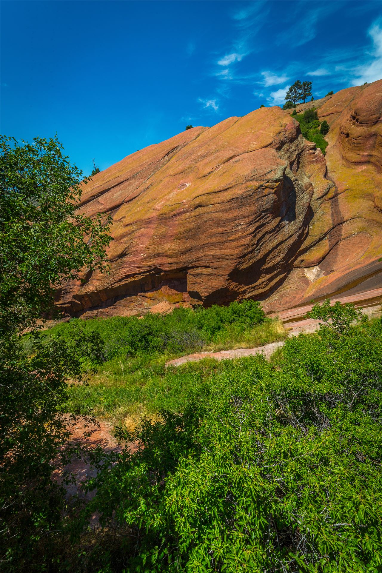 Red Rocks Park - From the Trading Post in Red Rocks Park, a brilliant blue-bird sky brings out all the colors in the area's geological features. by Scott Smith Photos