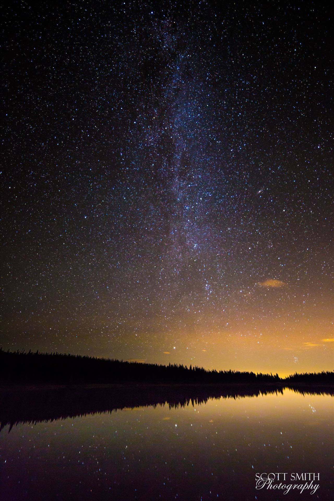 Milky Way over Brainard Lake - The Milky Way over Brainard Lake, on August 13th, during the Perseid meteor shower. No meteorites show in the image, but the reflection of the stars on the water is striking. The Andromeda galaxy makes an appearance, in the middle of the right half of the by Scott Smith Photos