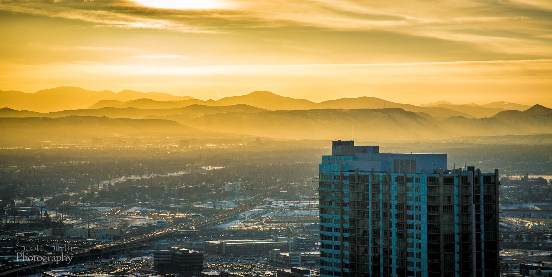 Sunset over Denver - Sunset from the 38th floor of the Grand Hyatt in Denver. by Scott Smith Photos