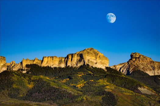 The moon rises over Chimney Peak outside of Ridgeway, Colorado.