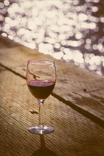 A glass of wine as the sun sets on Puget Sound, Seattle