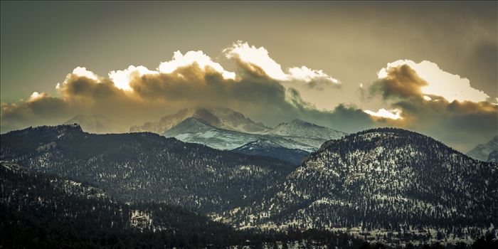 The sun sets over peaks in the Rocky Mountain National Park, as seen from near the famous Stanley Hotel in Estes Park.