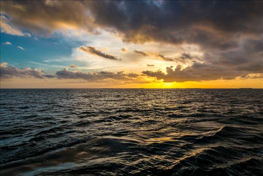 The sun sets outside of Key West, as seen from a catamaran cruise.