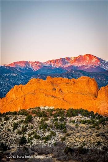 Pike's Peak, behind the Garden of the Gods, lit by the rising sun.