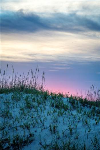The sun sets over the dunes in the outer banks, Corolla, North Carolina.