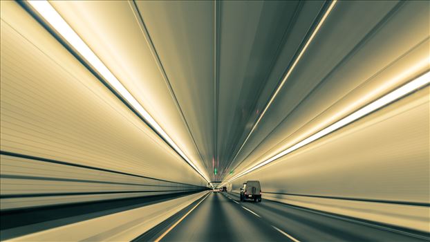 Lines nearly converge to infinity, in this long exposure handheld shot in Eisenhower Tunnel. Opened in 1973, the Eisenhower Tunnel in the Rocky Mountains of Colorado on interstate 70 is highest vehicle tunnel in the world at 11,155 feet.